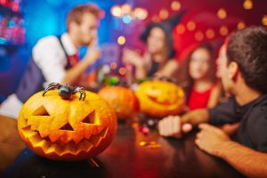 A Halloween party cuts pumpkins and pours drinks in Springfield